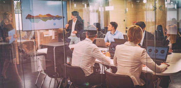 istock Board members listening to financial analyst giving a presentation 1028343618