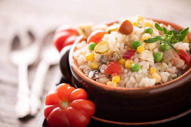 istock Traditional italian rice salad on wood table 1028346810