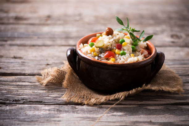 istock Traditional italian rice salad on wood table 1028348194