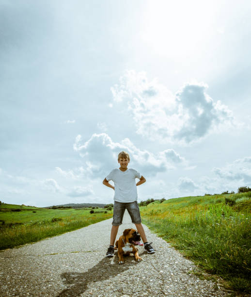 istock Boy with His Dog Outdoors 1028351978