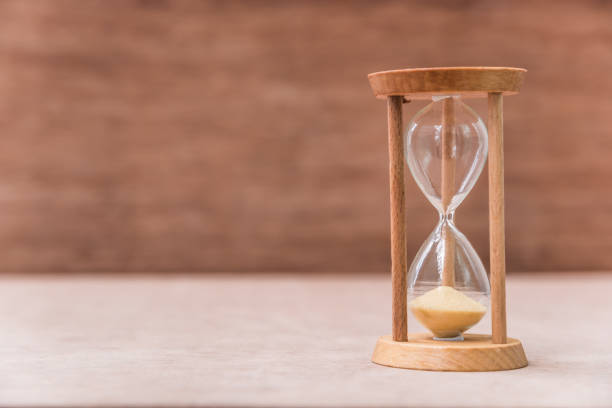 istock Close-Up Of Hourglass On Table 1028359778