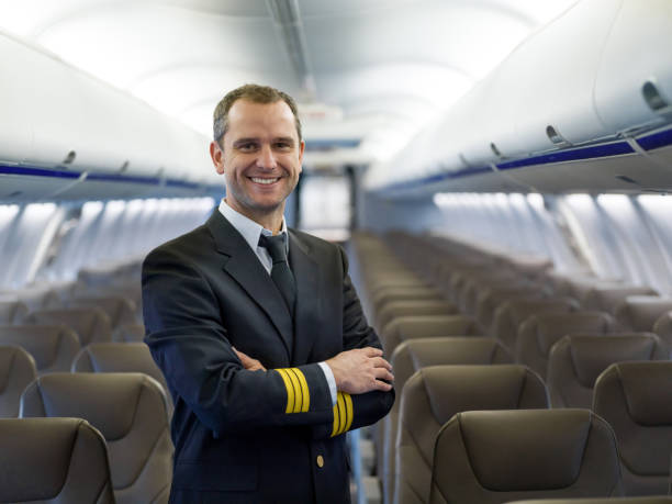 istock Portrait of a happy pilot in an airplane 1028360430