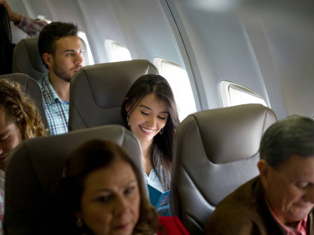 istock Happy woman traveling by plane 1028360478