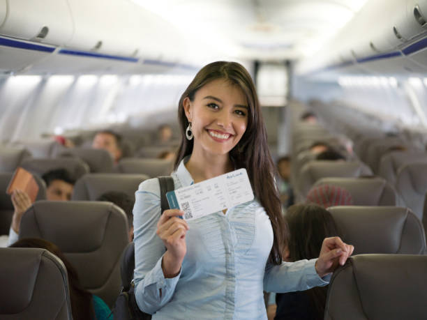 istock Happy woman traveling by plane 1028360486