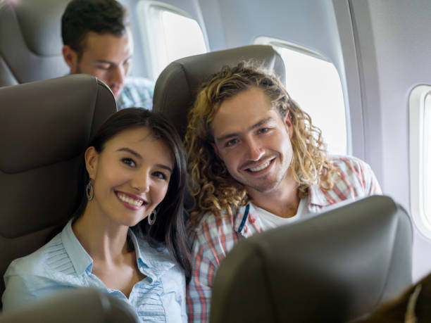 istock Happy couple traveling by plane 1028360498