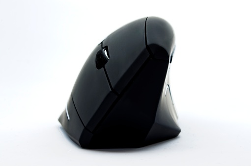 Top view of a minimalist black wireless computer mouse, isolated on white background.