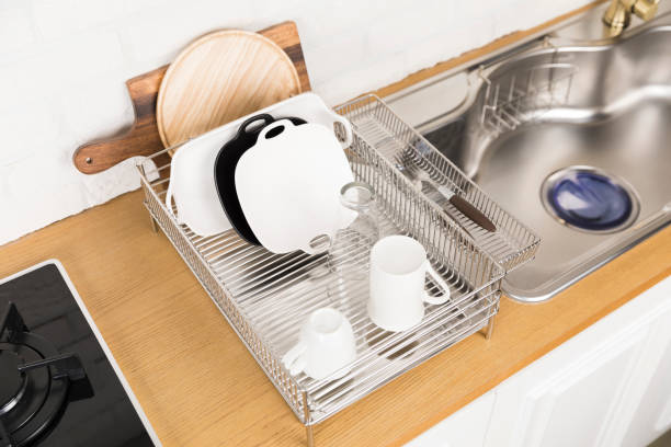 istock Kitchen with various kitchen tools, background with kitchen racks and plants. The appearance of drying dishes and bowls. 1028370012