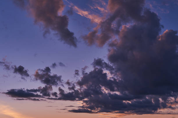 istock Sky at sunset with purple orange and blue hues 1028375582