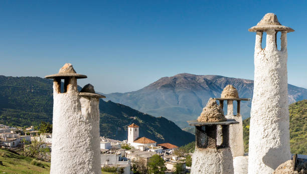 In the Sierra Nevada many villages can be found, of which the houses are all white. These houses have chimneys that are typical for the region Alpujarras, part of the mountain range of the Sierra Nevada. The village on the photo is Trévelez,