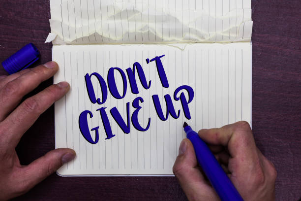 Writing note showing Don t not Give Up. Business photo showcasing Determined Persevering Continue to Believe in Yourself Man holding marker notebook page crumpled paper several tries mistakes Writing note showing Don t not Give Up. Business photo showcasing Determined Persevering Continue to Believe in Yourself Man holding marker notebook page crumpled paper several tries mistakes perpetual motion machine stock pictures, royalty-free photos & images