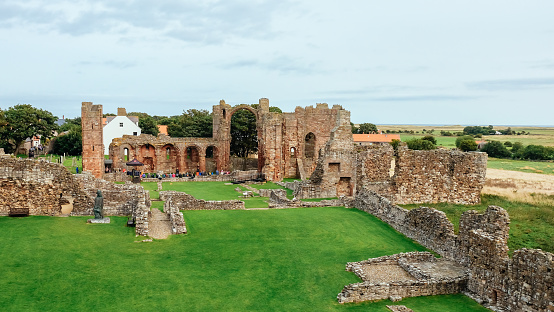 Holy Island of Lindisfarne, England-August 28, 2018: Look over the ruins of the Lindisfarne priory