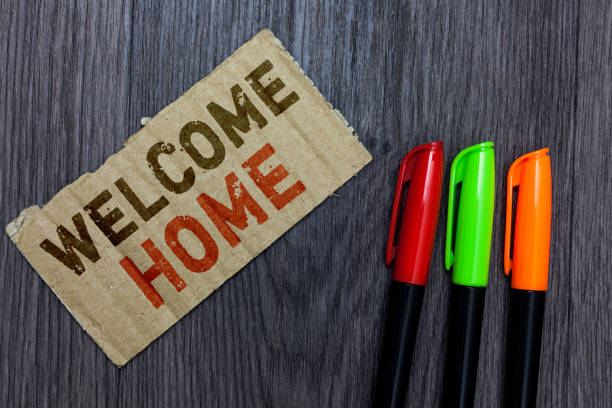 istock Word writing text Welcome Home. Business concept for Expression Greetings New Owners Domicile Doormat Entry Paperboard Important reminder Communicate ideas Markers Wooden background 1028383002