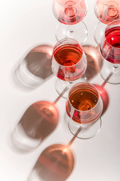 istock Glasses of white and pink wine with their shadows 1028386790