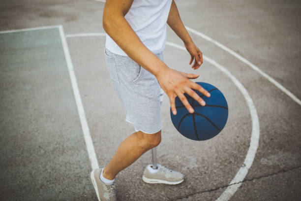 istock Adaptive athlete playing basketball 1028387324