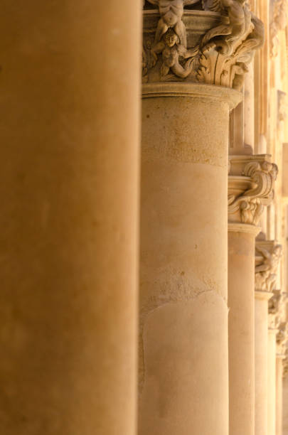 istock Stone pillars with figure-shaped chapitels 1028387448