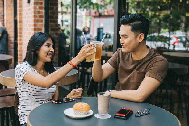 istock Young couple toasting in a Cafe 1028390822