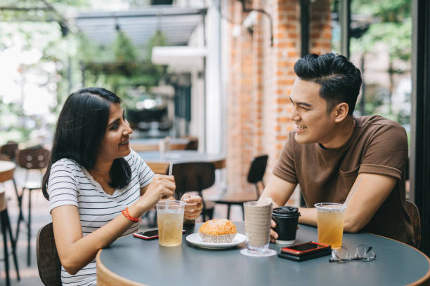 istock Smiling couple in a Cafe 1028390838