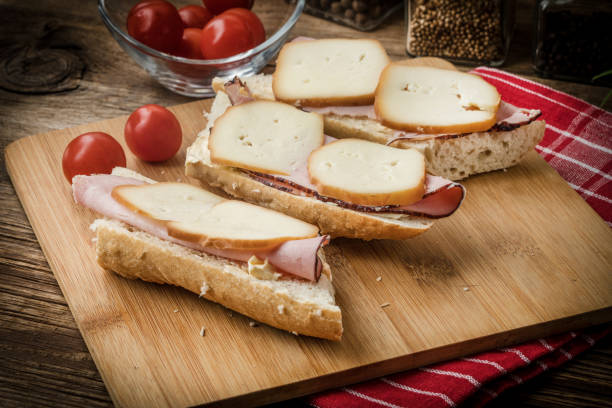 istock Sandwich with ham and smoked cheese. 1028393962