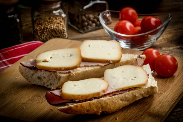istock Sandwich with ham and smoked cheese. 1028394062