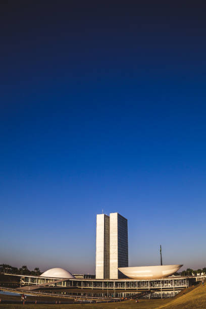 Side view from the national congress in brasília Brasília, DF, Brazil - August 12, 2018: Side view from the Nacional congress. This place is located at Eixo Monumental in Brasília/DF and this place was structured by the architect Oscar Niemayer city zoom out stock pictures, royalty-free photos & images