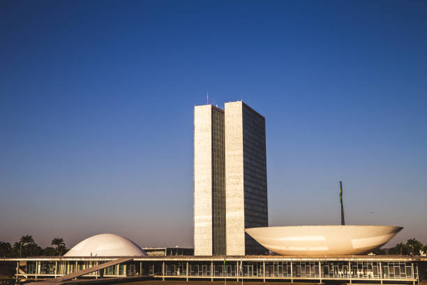 Side view from the national congress in brasília Brasília, DF, Brazil - August 12, 2018: Side view from the Nacional congress. This place is located at Eixo Monumental in Brasília/DF and this place was structured by the architect Oscar Niemayer city zoom out stock pictures, royalty-free photos & images