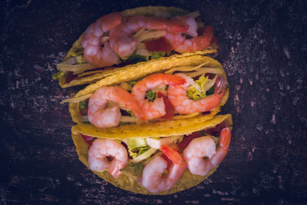 istock Preparing Mexican Tacos with Spicy Salsa and Shrimps 1028394552