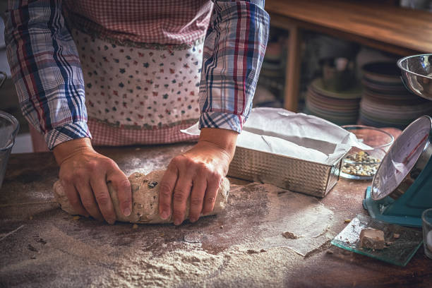 istock Kneading Loaf of Bread with Hands 1028394720