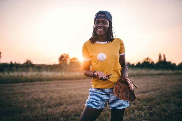 istock Gorgeous smiling black girl playing baseball 1028397192