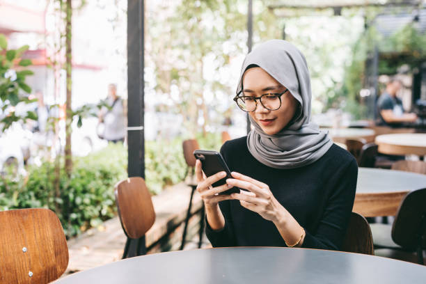 istock Young woman with smartphone 1028398162