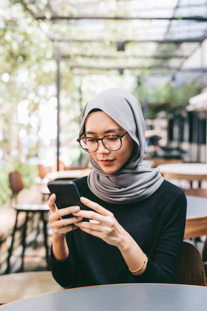 istock Young woman with smartphone 1028398168