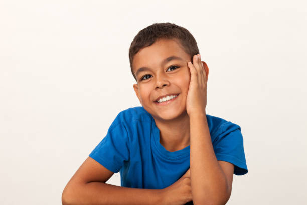 istock studio portrait of 10 year old schoolboy on white background 1028405086