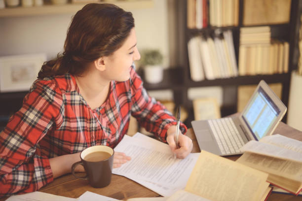 istock young woman working at home ( digital tablet) 1028407262