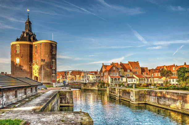 Dromedaris Gate in the golden hour Enkhuizen, The Netherlands, October 26, 2015: View of the Old Harbour and Dromedaris Gate in the golden hour enkhuizen stock pictures, royalty-free photos & images