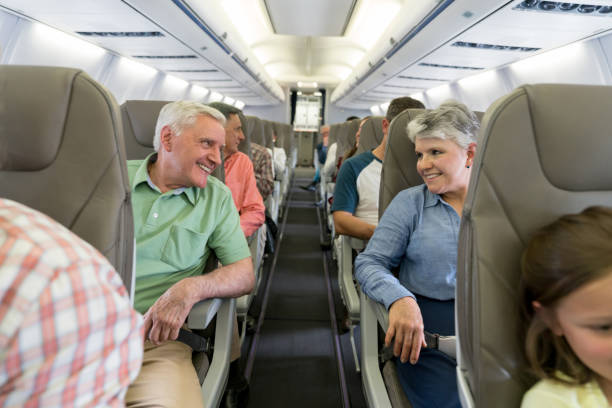 istock Happy senior couple traveling by plane 1028421472