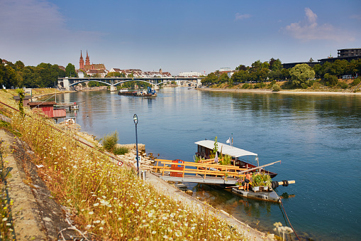 Scenic view of Rhine embankment with ferry boat station in Basel, Switzerland