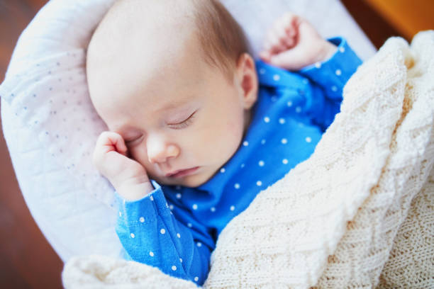 istock Adorable baby girl sleeping 1028427164