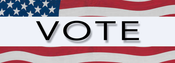istock US Stars and Stripes banner around word VOTE 1028427624