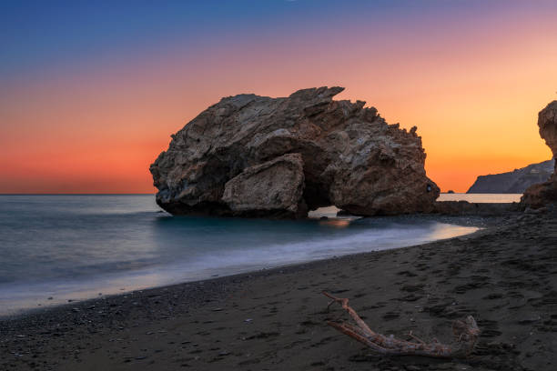 istock Sunset at the dragon head rock in Crete, Greece 1028430122