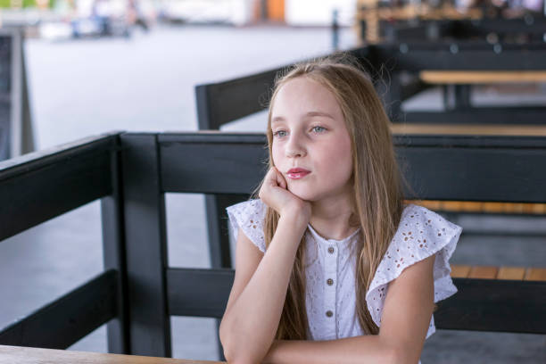 istock Charming blonde lady outside in street cafe 1028430180