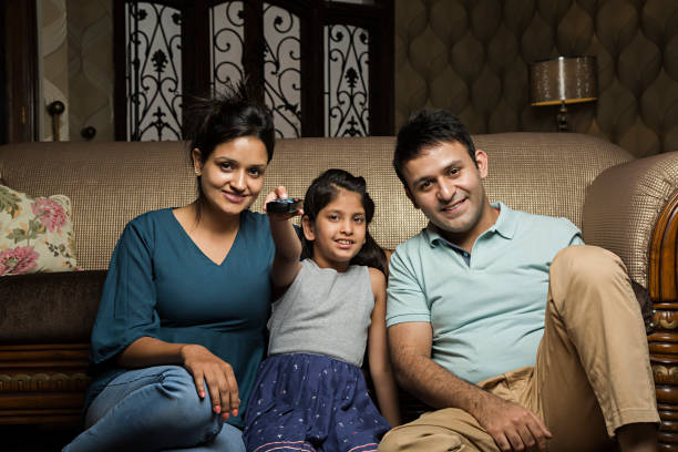 istock Family watching TV - Stock image 1028431560