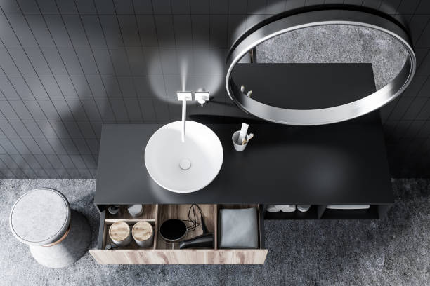 istock Top view of a sink in black tile bathroom 1028436006
