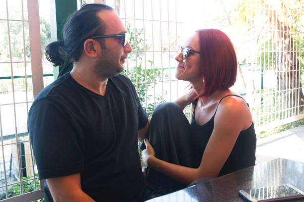 istock Romantic couple drinking coffee ,having a date in the cafe. 1028436126