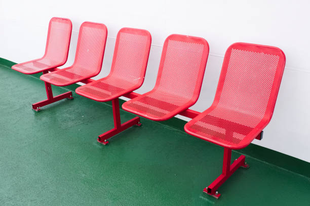 Rows of red empty seats on green floor ship ferry Scotland uk