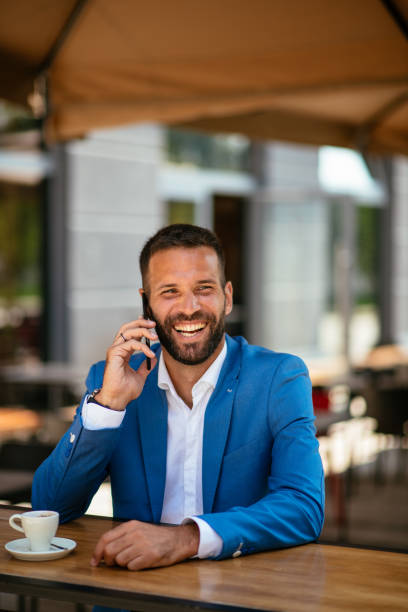 istock Hadsome young businessman talking on his phone 1028438548