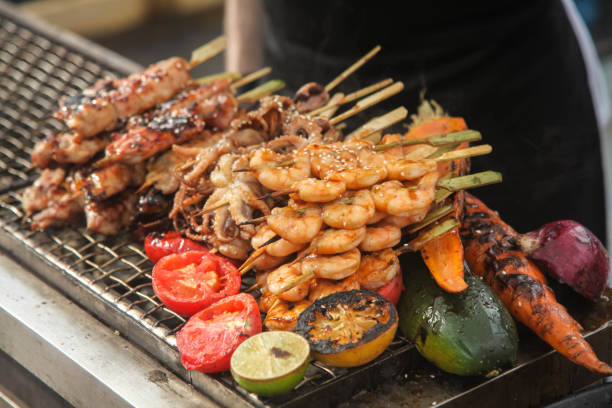 istock Fresh grilled shrimp and octopus kebabs with lemon and avocado 1028439364