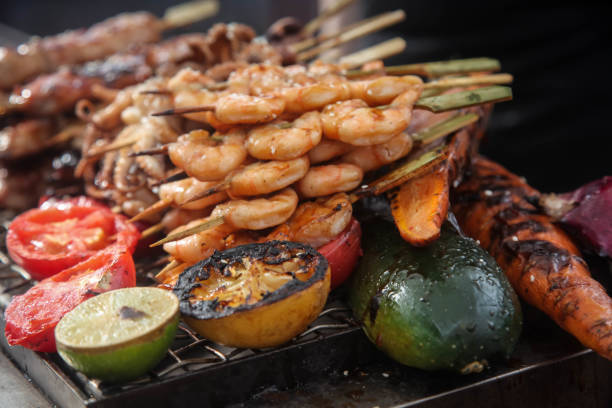 istock Fresh grilled shrimp and octopus kebabs with lemon and avocado 1028439384