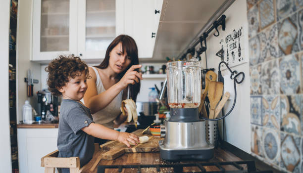istock Mother and son cooking 1028440108