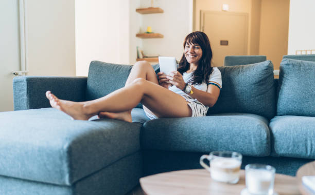 Smiling woman with digital tablet