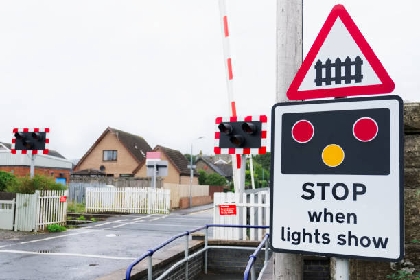 istock Stop when lights show at train rail crossing 1028449482