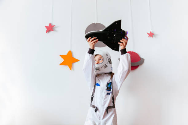 istock girl full of dreams flying a space ship 1028449908